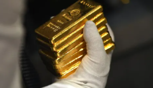 美联储刺激政策评论后黄金回落，美元上涨